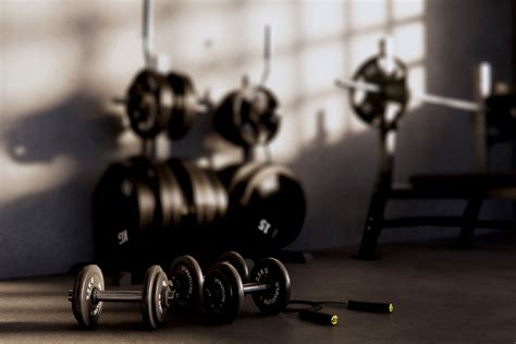 Barbells and dumbbells on the gym floor